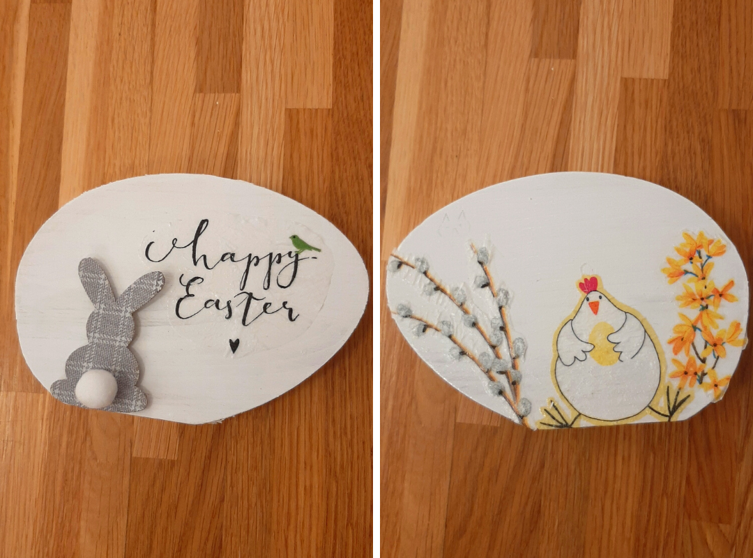 zdjęcie przedstawiające dwie formy drewniane w kształcie jajek ozdobione metodą decoupage: królik z napisem happy easter oraz kura z jajkiem